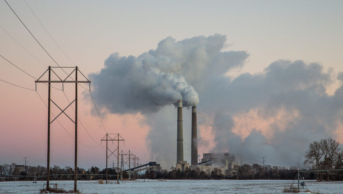 Power plant creating a large white plume.